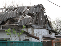 A private house is being damaged by the fall of Russian missile fragments in Dnipro, Ukraine, on April 15, 2024. (