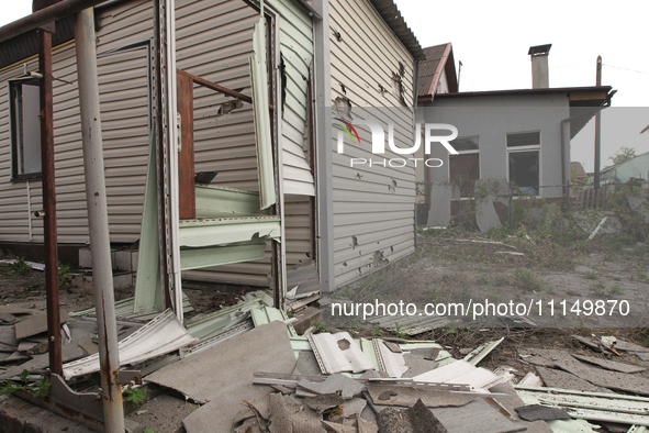 A private house is being damaged by the fall of Russian missile fragments in Dnipro, Ukraine, on April 15, 2024. 