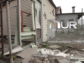 A private house is being damaged by the fall of Russian missile fragments in Dnipro, Ukraine, on April 15, 2024. (