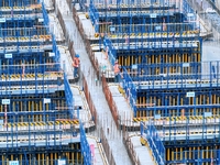 Construction workers are working at the construction site of the Zhangjinggao Yangtze River Bridge in Rugao, Jiangsu Province, China, on Apr...