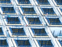 Construction workers are working at the construction site of the Zhangjinggao Yangtze River Bridge in Rugao, Jiangsu Province, China, on Apr...