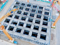 Construction workers are working at the construction site of the Zhangjinggao Yangtze River Bridge in Rugao, Jiangsu Province, China, on Apr...