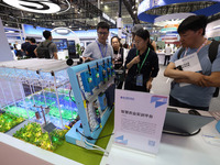 People are visiting a training platform for smart agriculture at the 61st China Higher Education Expo in Fuzhou, Fujian Province, China, on...