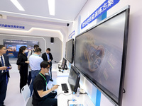 Citizens are experiencing VR projects at the exhibition area of the 61st China Higher Education Expo in Fuzhou, Fujian province, China, on A...