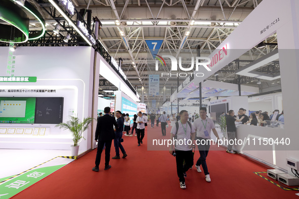 Citizens are visiting the exhibition area of the 61st China Higher Education Expo in Fuzhou, Fujian Province, China, on April 15, 2024. 