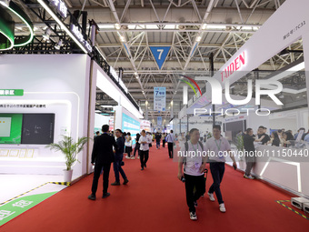 Citizens are visiting the exhibition area of the 61st China Higher Education Expo in Fuzhou, Fujian Province, China, on April 15, 2024. (