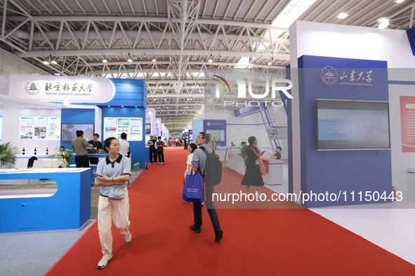 Citizens are visiting the exhibition area of the 61st China Higher Education Expo in Fuzhou, Fujian Province, China, on April 15, 2024. 