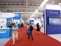 Citizens are visiting the exhibition area of the 61st China Higher Education Expo in Fuzhou, Fujian Province, China, on April 15, 2024. (