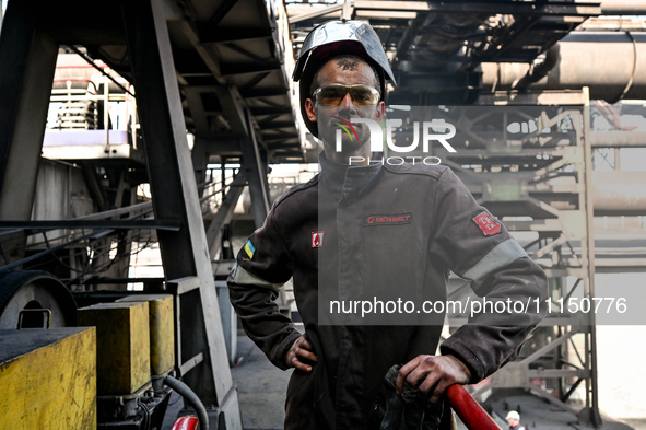 A worker from PJSC Zaporizhcoke is posing for a photo in Zaporizhzhia, Ukraine, on April 11, 2024. NO USE RUSSIA. NO USE BELARUS. 