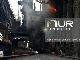 A worker is seen on the premises of PJSC Zaporizhcoke in Zaporizhzhia, Ukraine, on April 11, 2024. NO USE RUSSIA. NO USE BELARUS. (