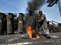 A worker is sweeping on the premises of PJSC Zaporizhcoke in Zaporizhzhia, southeastern Ukraine, on April 11, 2024. NO USE RUSSIA. NO USE BE...