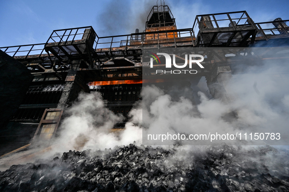 People are working on the premises of PJSC Zaporizhcoke in Zaporizhzhia, southeastern Ukraine, on April 11, 2024. 