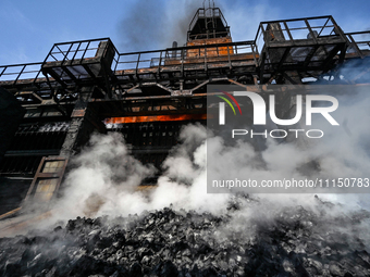 People are working on the premises of PJSC Zaporizhcoke in Zaporizhzhia, southeastern Ukraine, on April 11, 2024. (