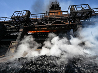 People are working on the premises of PJSC Zaporizhcoke in Zaporizhzhia, southeastern Ukraine, on April 11, 2024. (