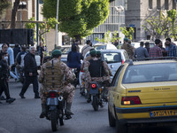 Members of the Islamic Revolutionary Guard Corps (IRGC) Special Forces are riding motorcycles during a celebration of the IRGC's unmanned ae...