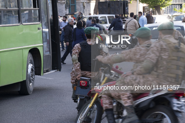 Members of the Islamic Revolutionary Guard Corps (IRGC) Special Forces are riding motorcycles during a celebration of the IRGC's unmanned ae...