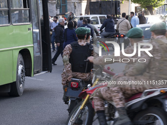 Members of the Islamic Revolutionary Guard Corps (IRGC) Special Forces are riding motorcycles during a celebration of the IRGC's unmanned ae...