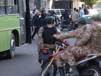 Members of the Islamic Revolutionary Guard Corps (IRGC) Special Forces are riding motorcycles during a celebration of the IRGC's unmanned ae...