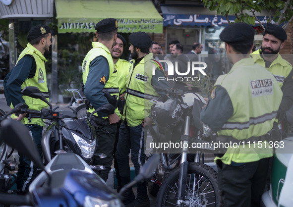 Iranian police special forces are standing together during a gathering to celebrate the IRGC's unmanned aerial vehicle (UAV) and missile att...