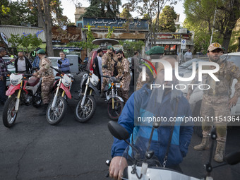 Members of the Islamic Revolutionary Guard Corps (IRGC) Special Forces are standing together at a celebration for the IRGC's unmanned aerial...