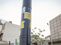 An unidentified man is holding a model of Iran's first-ever hypersonic missile, Fattah, during a gathering to celebrate the IRGC UAV and mis...