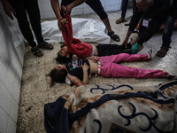 Palestinians are mourning the death of loved ones following an Israeli bombardment in Maghazi in the central Gaza Strip, on April 16, 2024,...