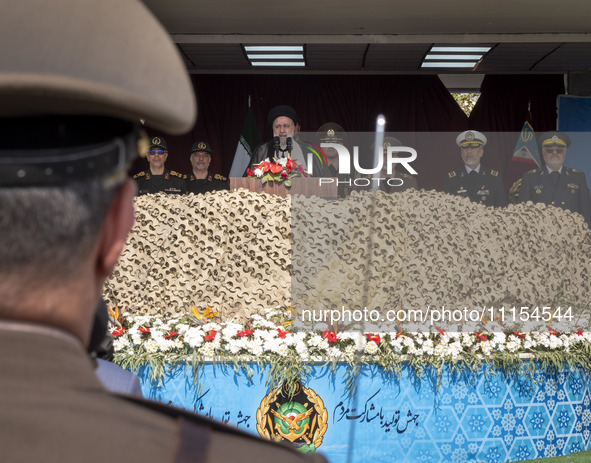 Iranian President Ebrahim Raisi (C) is attending a military parade to mark Iran's Army Day anniversary at an Army military base in Tehran, I...