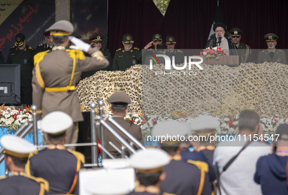 Iranian President Ebrahim Raisi (3rd R) is attending a military parade to mark Iran's Army Day anniversary at an Army military base in Tehra...