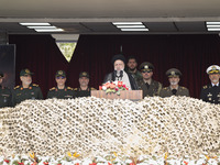 Iranian President Ebrahim Raisi (C) is addressing attendees at a military parade marking Iran's Army Day anniversary at an Army military bas...