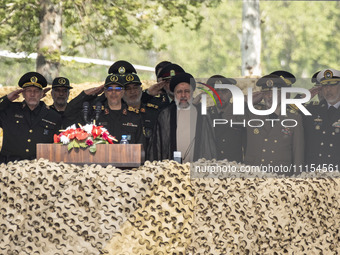 Iranian President Ebrahim Raisi (C) is attending a military parade to mark Iran's Army Day anniversary at an Army military base in Tehran, I...