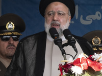 Iranian President Ebrahim Raisi is addressing attendees at a military parade marking Iran's Army Day anniversary at an Army military base in...