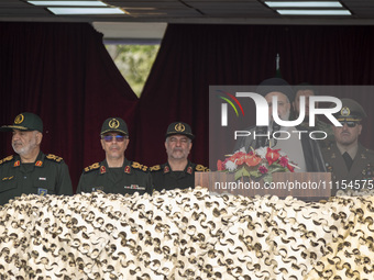 Iranian President Ebrahim Raisi (3rd R) is addressing attendees at a military parade marking Iran's Army Day anniversary at an Army military...