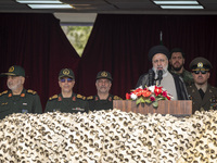 Iranian President Ebrahim Raisi (3rd R) is addressing attendees at a military parade marking Iran's Army Day anniversary at an Army military...