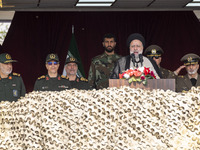 Iranian President Ebrahim Raisi (3rd R) is addressing attendees at a military parade marking Iran's Army Day anniversary at an Army military...