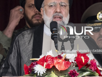 Iranian President Ebrahim Raisi is addressing attendees at a military parade marking Iran's Army Day anniversary at an Army military base in...