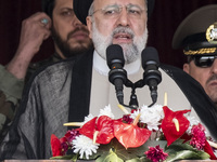 Iranian President Ebrahim Raisi is addressing attendees at a military parade marking Iran's Army Day anniversary at an Army military base in...