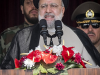 Iranian President Ebrahim Raisi is addressing attendees at a military parade marking Iran's Army Day anniversary at an Army military base in...