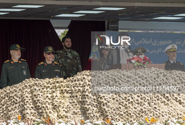 Iranian President Ebrahim Raisi (2nd R) is addressing attendees at a military parade marking Iran's Army Day anniversary at an Army military...