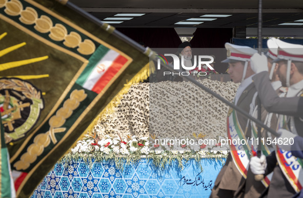 Iranian President Ebrahim Raisi (C) is attending a military parade to mark Iran's Army Day anniversary at an Army military base in Tehran, I...