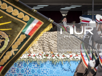 Iranian President Ebrahim Raisi (C) is attending a military parade to mark Iran's Army Day anniversary at an Army military base in Tehran, I...