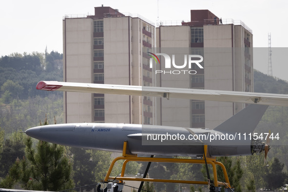 A truck is carrying an Iranian-made Unmanned Aerial Vehicle (UAV) during a military parade marking Iran's Army Day anniversary at an Army mi...