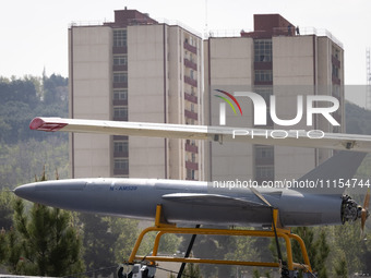 A truck is carrying an Iranian-made Unmanned Aerial Vehicle (UAV) during a military parade marking Iran's Army Day anniversary at an Army mi...