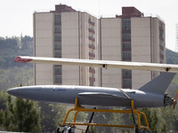 A truck is carrying an Iranian-made Unmanned Aerial Vehicle (UAV) during a military parade marking Iran's Army Day anniversary at an Army mi...