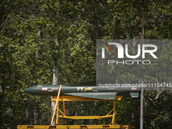 A truck is carrying an Iranian-made Asr-67 missile during a military parade marking Iran's Army Day anniversary at an Army military base in...