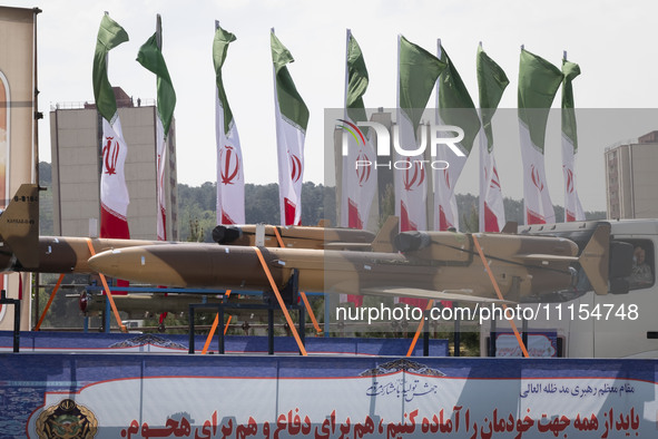 A truck is carrying an Iranian-made Unmanned Aerial Vehicle (UAV) during a military parade marking Iran's Army Day anniversary at an Army mi...