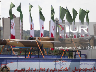 A truck is carrying an Iranian-made Unmanned Aerial Vehicle (UAV) during a military parade marking Iran's Army Day anniversary at an Army mi...