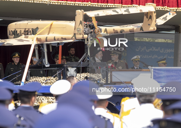 A truck is carrying an Iranian-made Unmanned Aerial Vehicle (UAV) during a military parade that marks Iran's Army Day, as Iranian President...