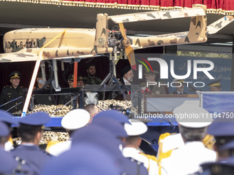 A truck is carrying an Iranian-made Unmanned Aerial Vehicle (UAV) during a military parade that marks Iran's Army Day, as Iranian President...