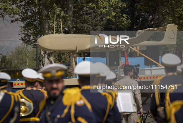 A truck is carrying an Iranian-made Unmanned Aerial Vehicle (UAV) during a military parade marking Iran's Army Day anniversary at an Army mi...