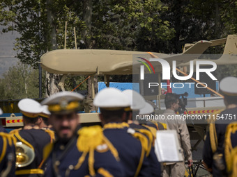 A truck is carrying an Iranian-made Unmanned Aerial Vehicle (UAV) during a military parade marking Iran's Army Day anniversary at an Army mi...